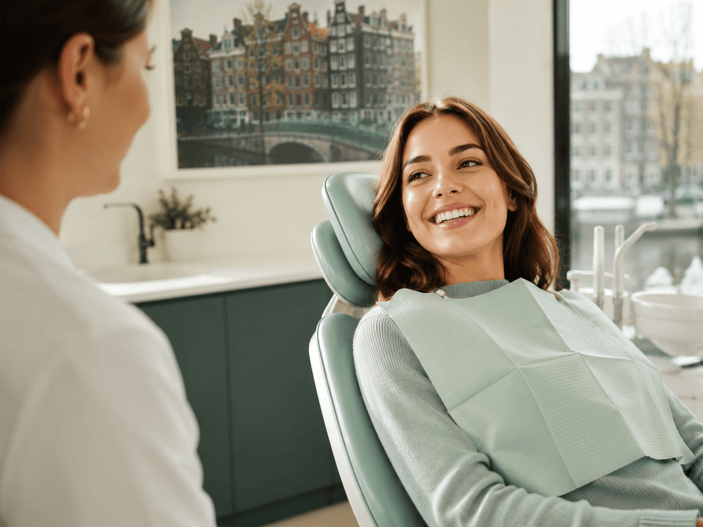Patient smiling during a dental visit, from the Aurelia Dental concept